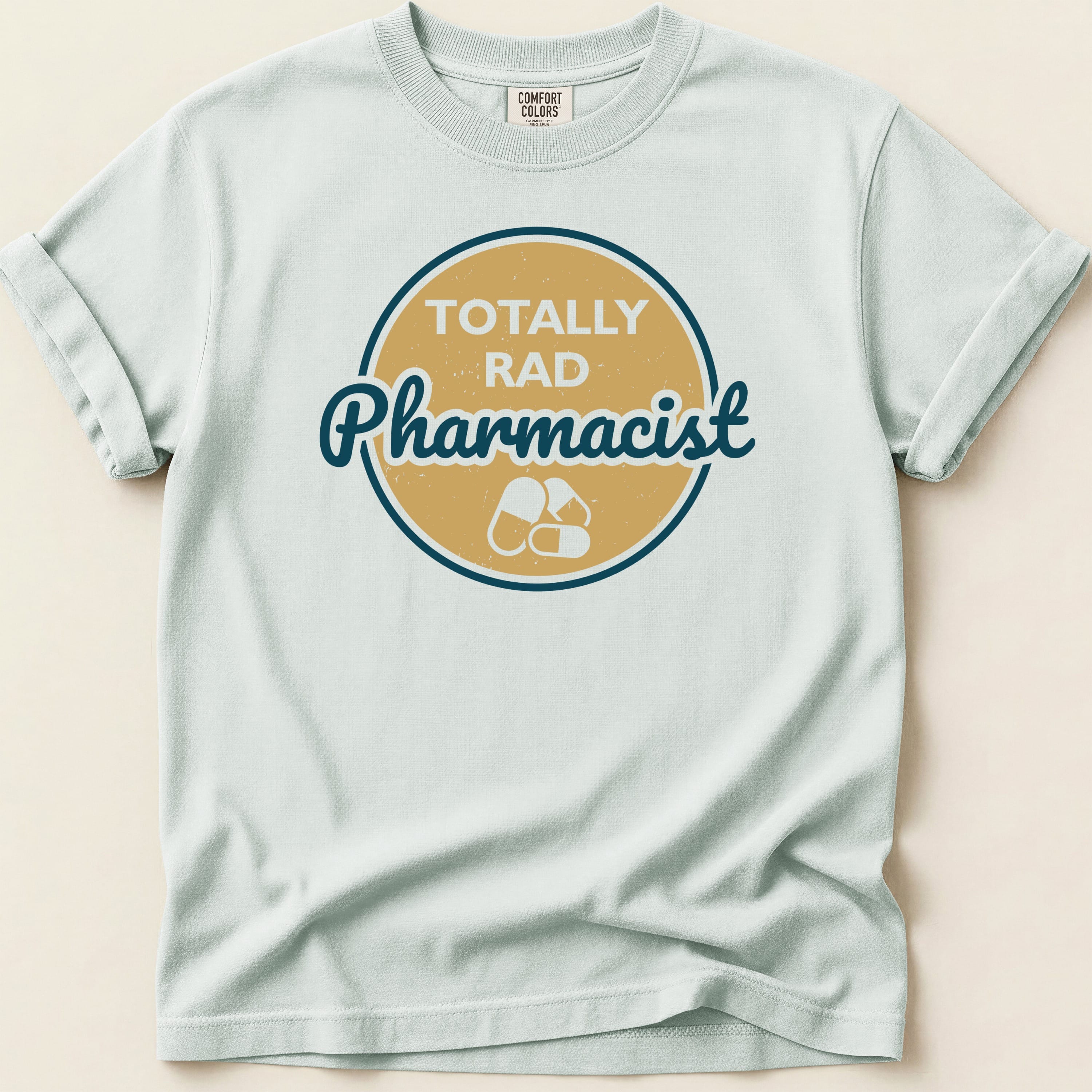 Light blue t-shirt with "Totally Rad Pharmacist" and capsule graphic.