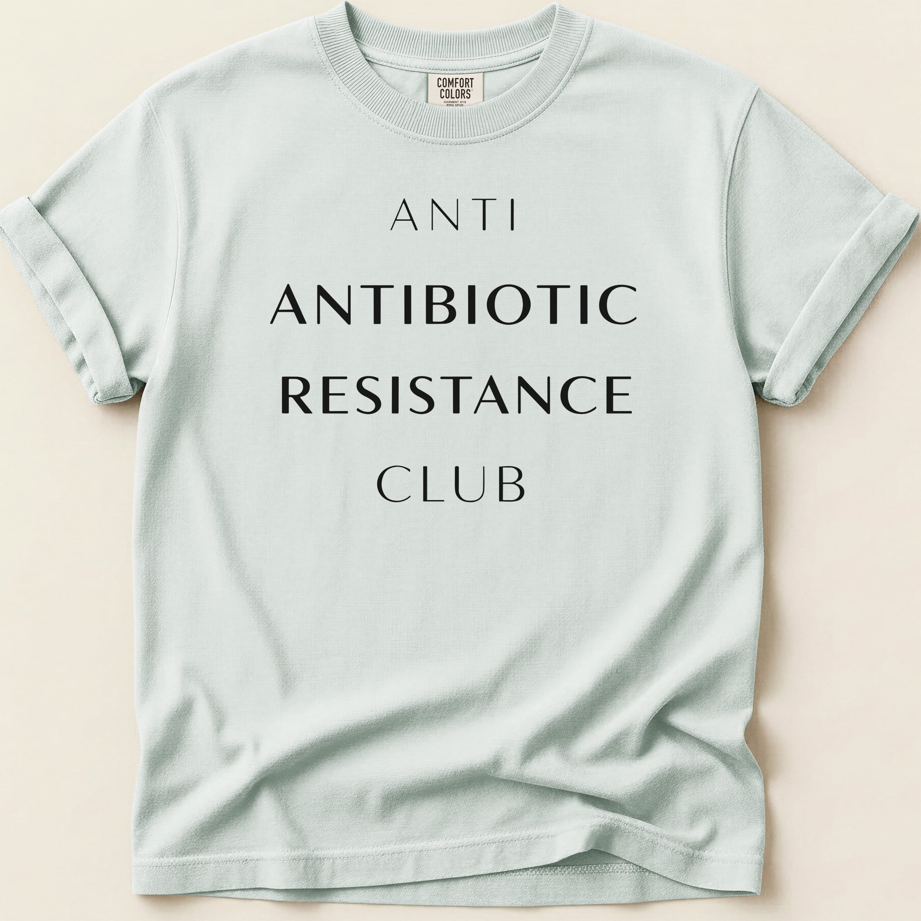 Light blue Comfort Colors t-shirt with "ANTI ANTIBIOTIC RESISTANCE CLUB" text.