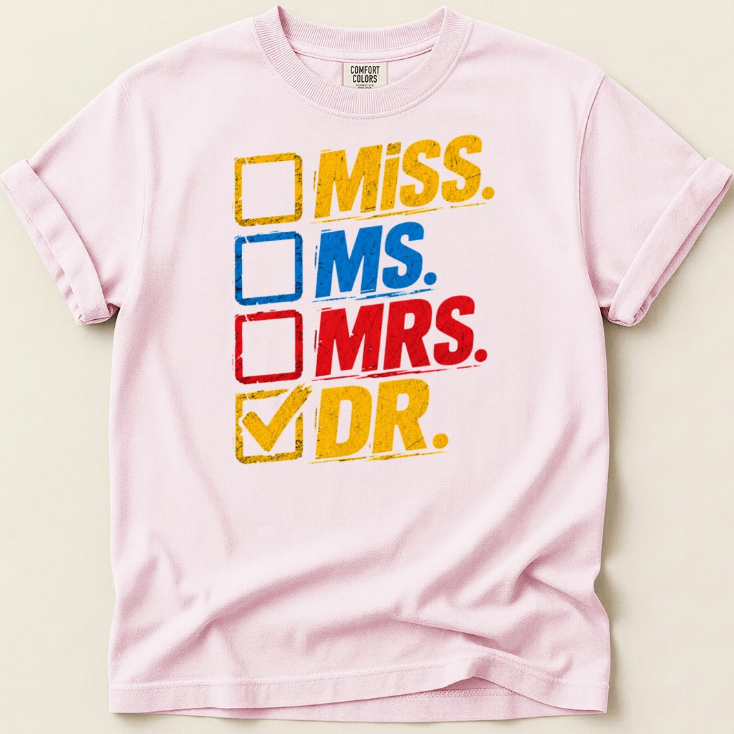 Pink t-shirt with a checklist including Miss, Ms., Mrs., and checked Dr.