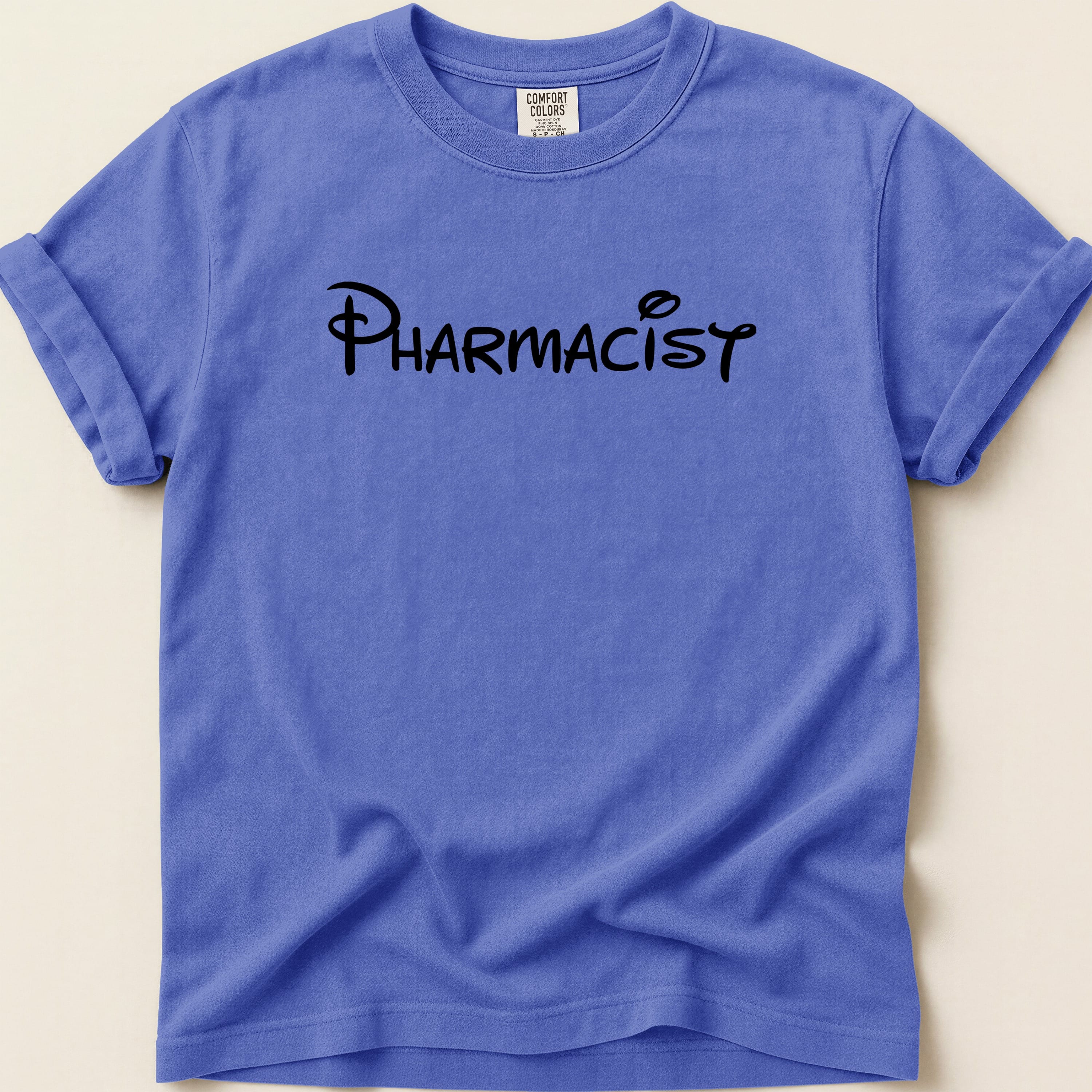 Blue t-shirt with "PHARMACIST" in black Disney-style font.