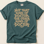 Teal t-shirt with "Not That Kind of Doctor, The Other Kind of Doctor" text.
