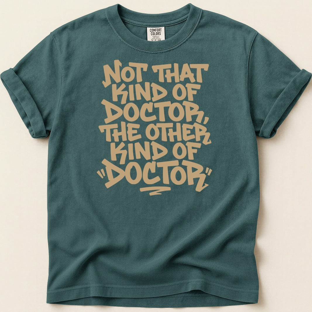 Teal t-shirt with "Not That Kind of Doctor, The Other Kind of Doctor" text.