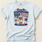 T-shirt with "Proudly Dispensing Freedom Since 1776" and patriotic pill characters.