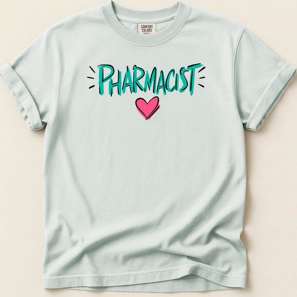 Light blue t-shirt with "PHARMACIST" in teal text and a pink heart.