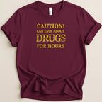 Maroon t-shirt with yellow distressed text: Caution! Can talk about drugs for hours.