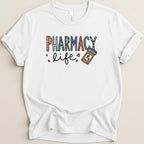 White t-shirt with colorful "Pharmacy Life" text and a pill bottle.
