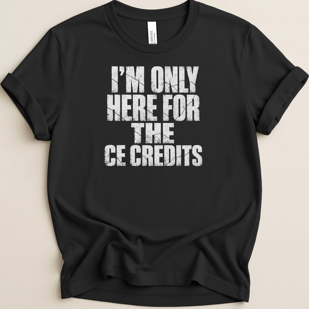 Black t-shirt with white cracked text: "I'M ONLY HERE FOR THE CE CREDITS".