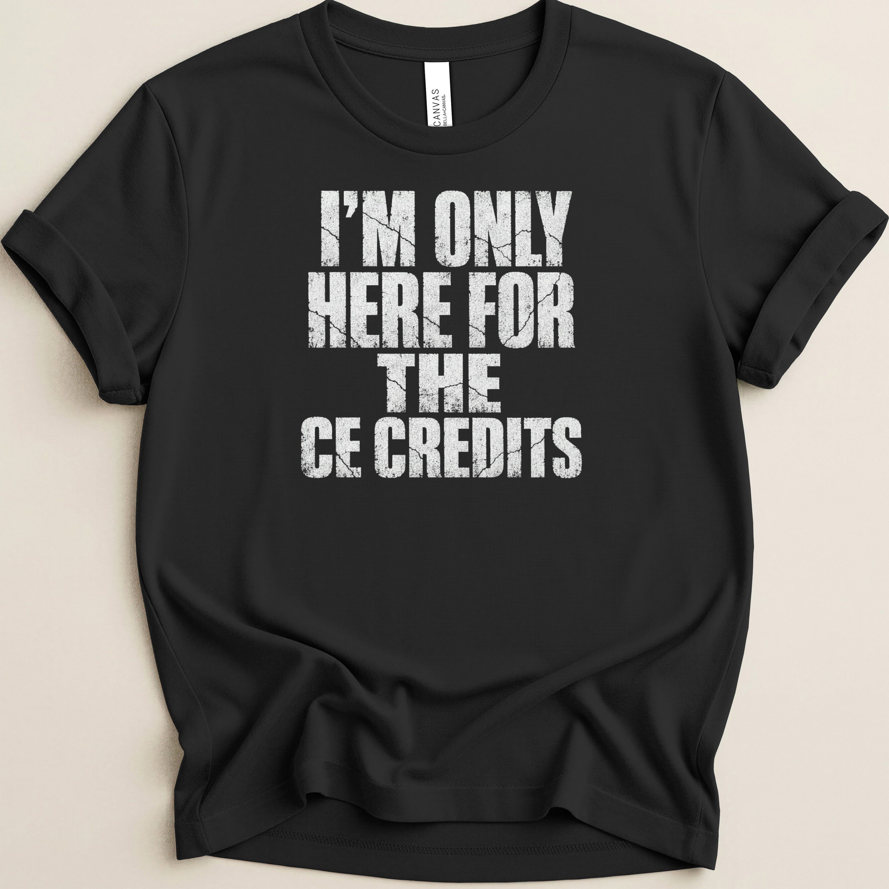 Black t-shirt with white cracked text: "I'M ONLY HERE FOR THE CE CREDITS".
