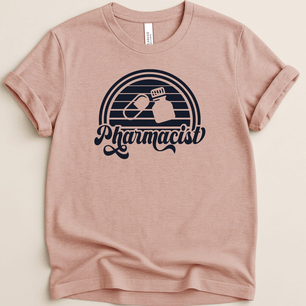 Pink t-shirt with retro "Pharmacist" text and pill graphic.
