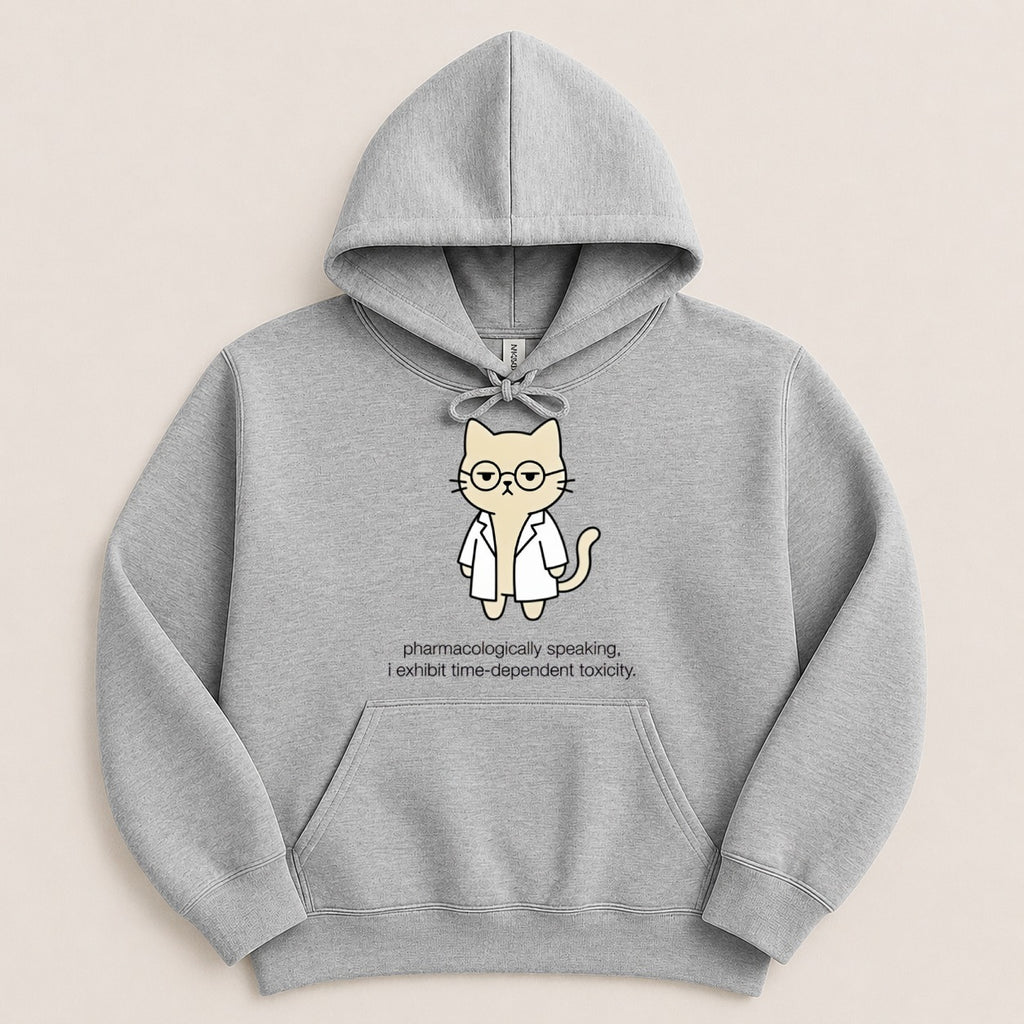 Grey hoodie with cartoon cat in a lab coat and glasses, text says "pharmacologically speaking, I exhibit time-dependent toxicity."