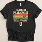 Retired Pharmacist refills remaining: 0 graphic on black t-shirt.