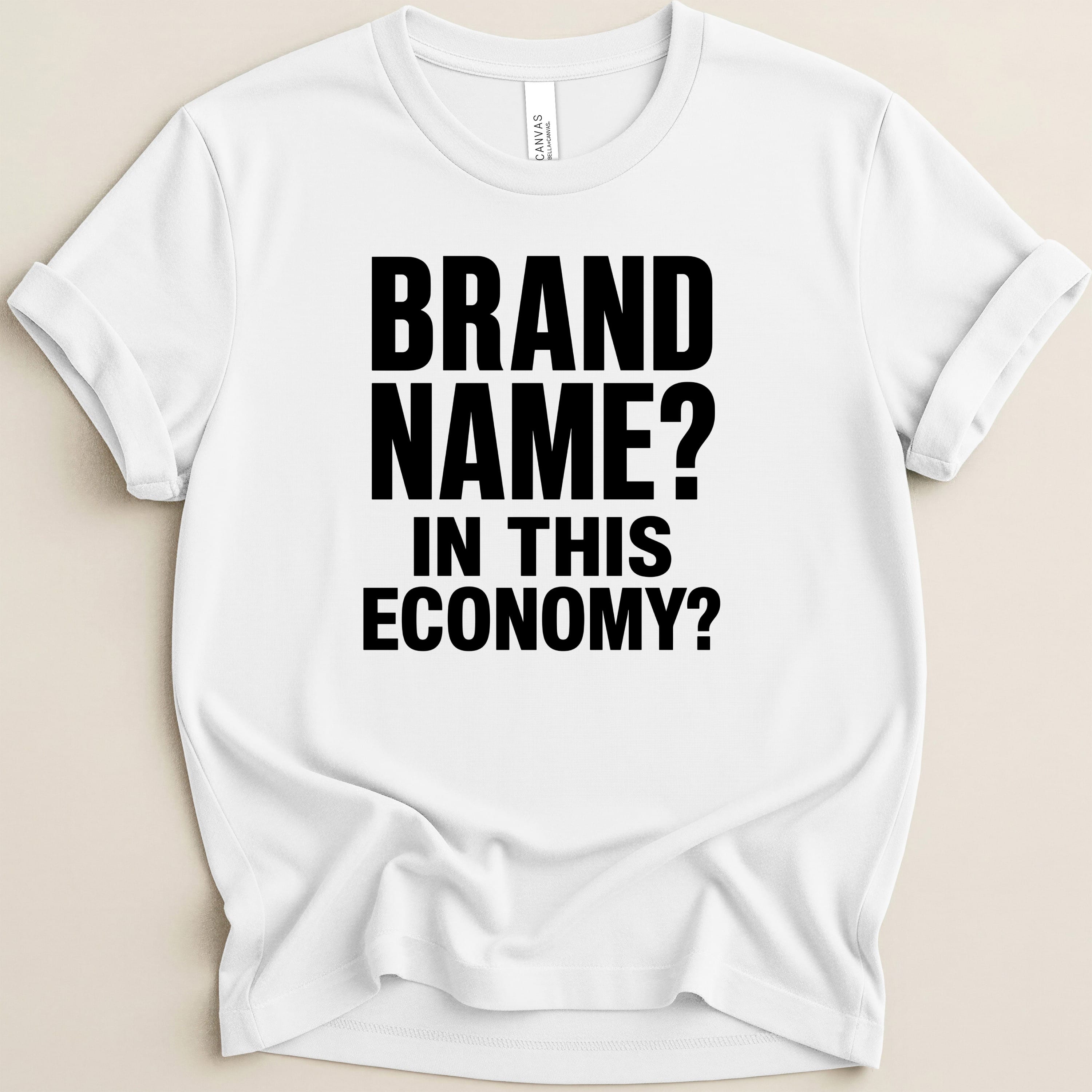 White t-shirt with black text "BRAND NAME? IN THIS ECONOMY?".
