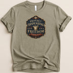 T-shirt with "Proudly Dispensing Freedom Since 1776" text and mortar and pestle emblem.