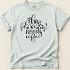 Comfort Colors t-shirt with "this pharmacist needs coffee" text and small hearts.