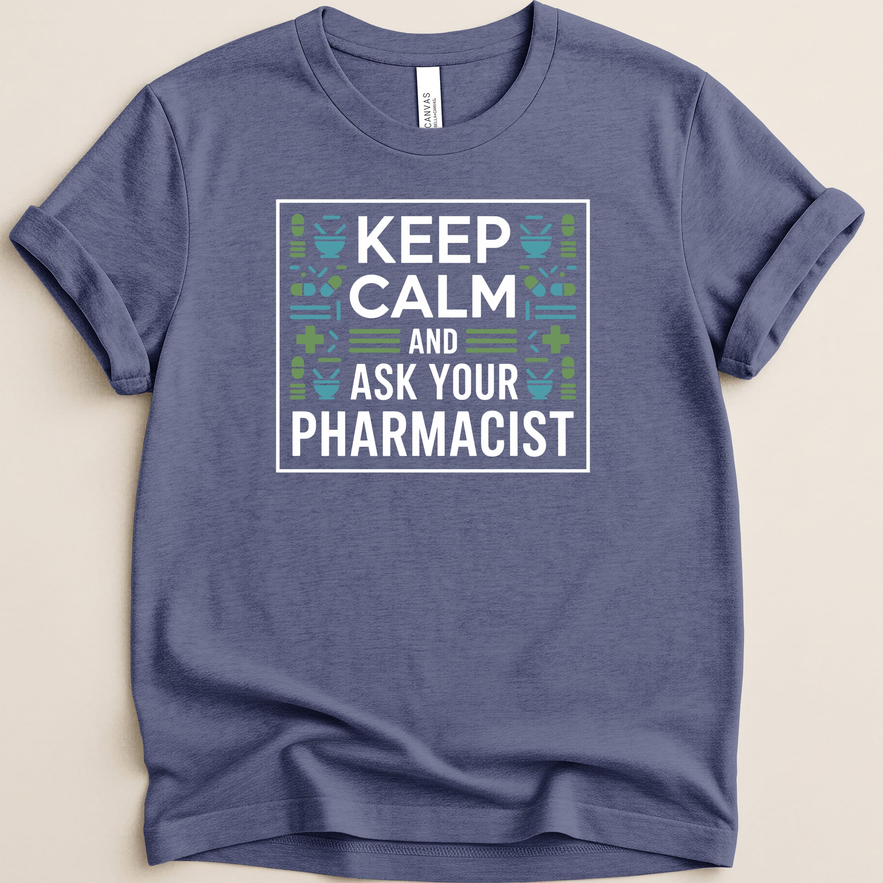 Blue t-shirt with "KEEP CALM AND ASK YOUR PHARMACIST" text and geometric pattern.