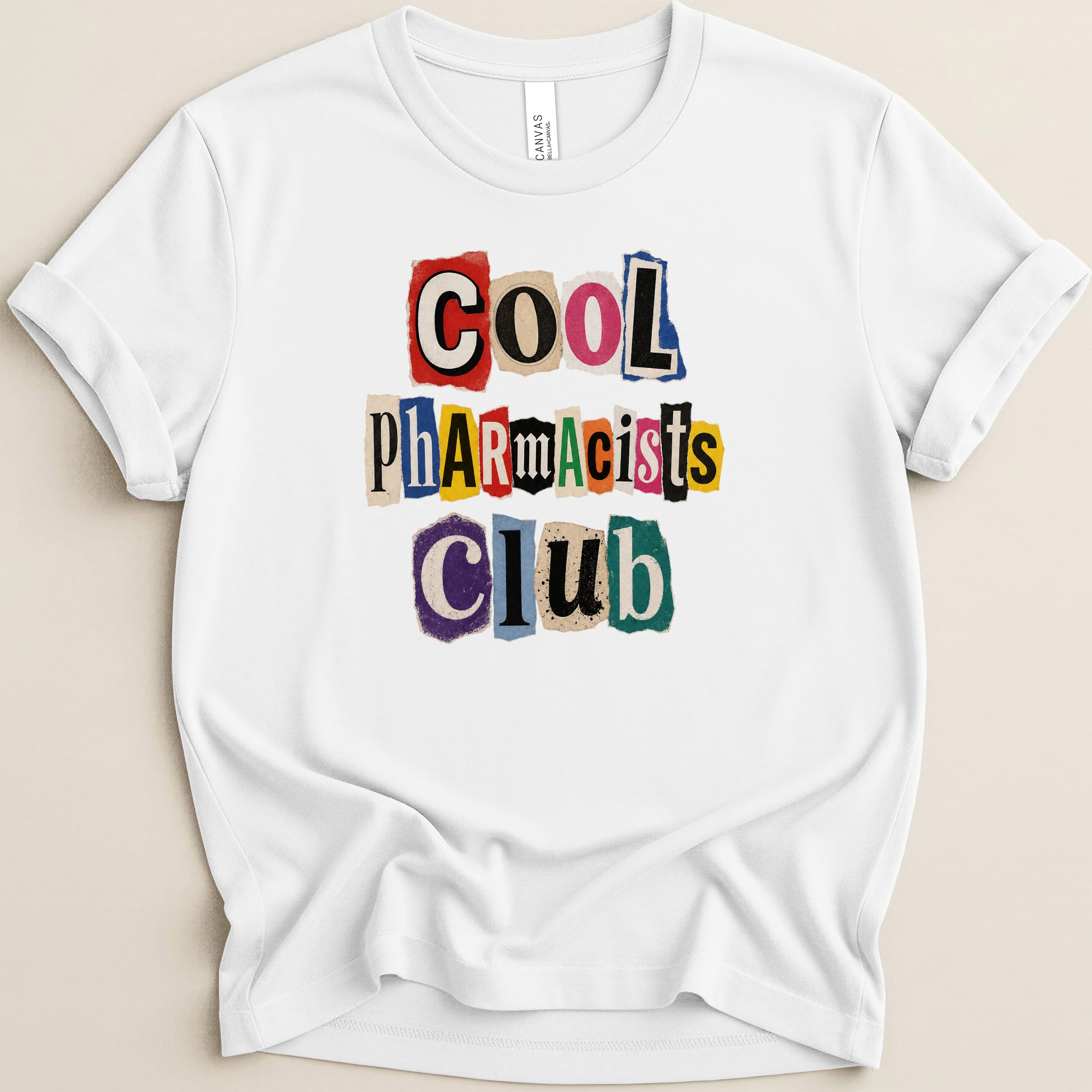 White t-shirt with "COOL PHARMACISTS CLUB" in cut-out magazine letters.