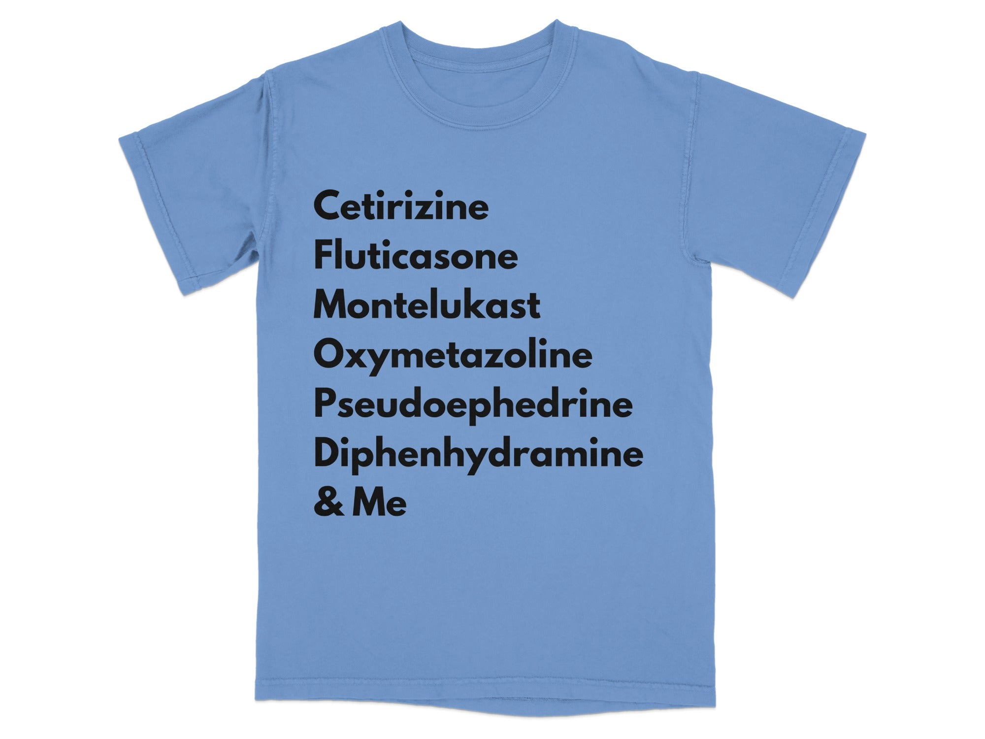 Light blue t-shirt with a black text list of medication names.