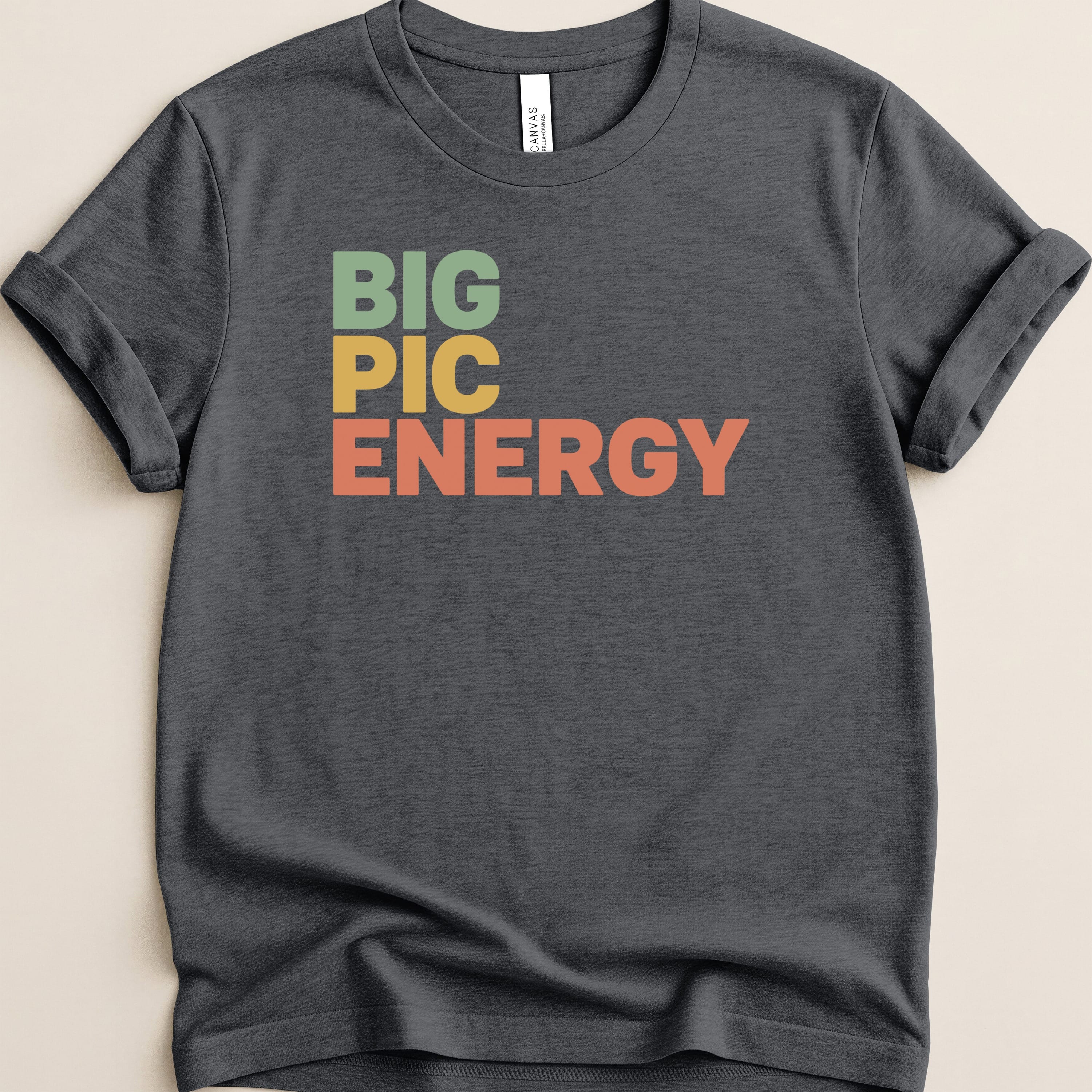 Dark t-shirt with "BIG PIC ENERGY" in colorful block letters.