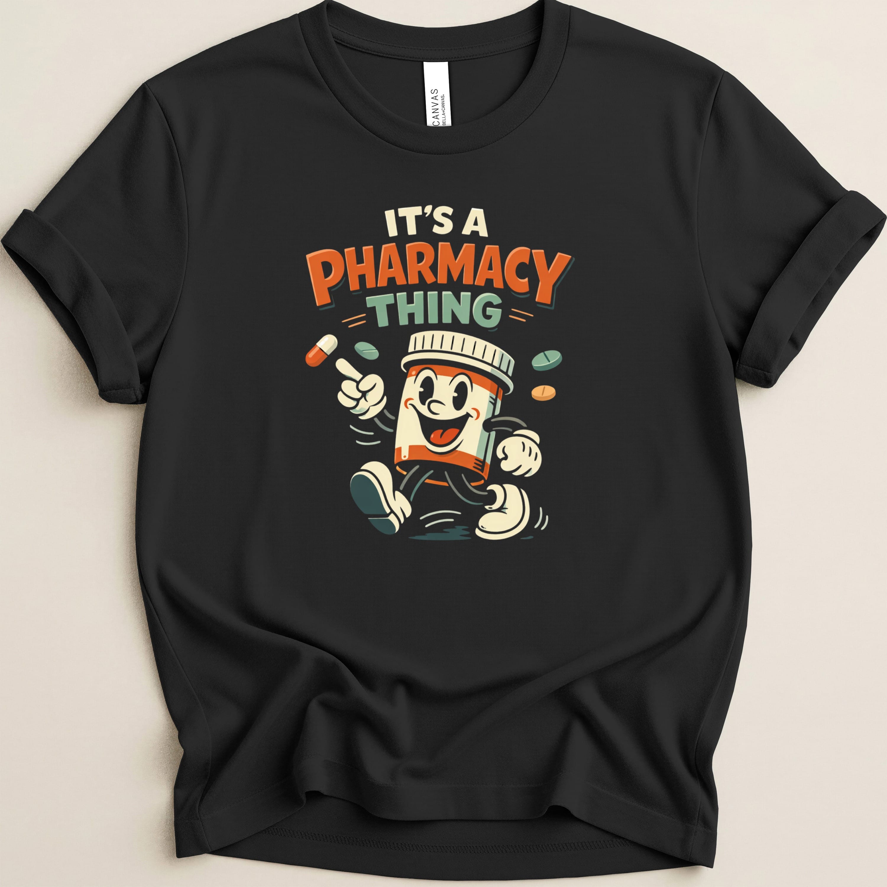 Black t-shirt with cartoon pill bottle and "It's a Pharmacy Thing" text.