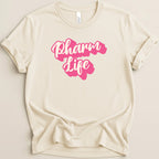 Cream t-shirt with pink "Pharm Life" text design.