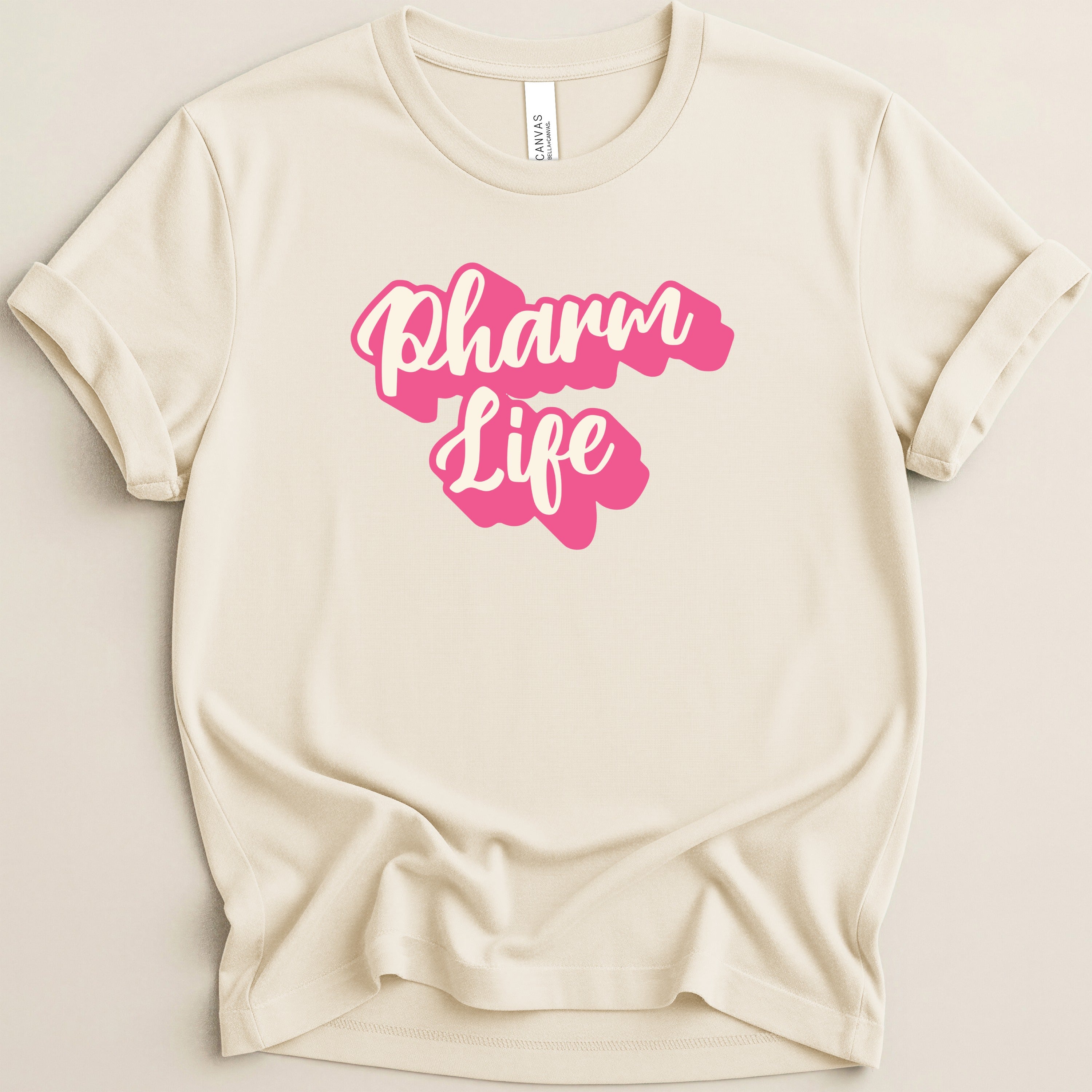 Cream t-shirt with pink "Pharm Life" text design.
