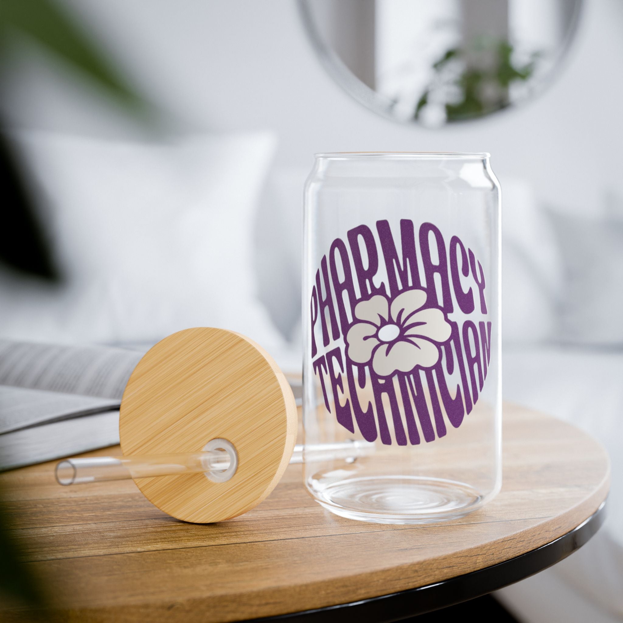Clear glass can-shaped cup with purple "Pharmacy Technician" text and flower design.