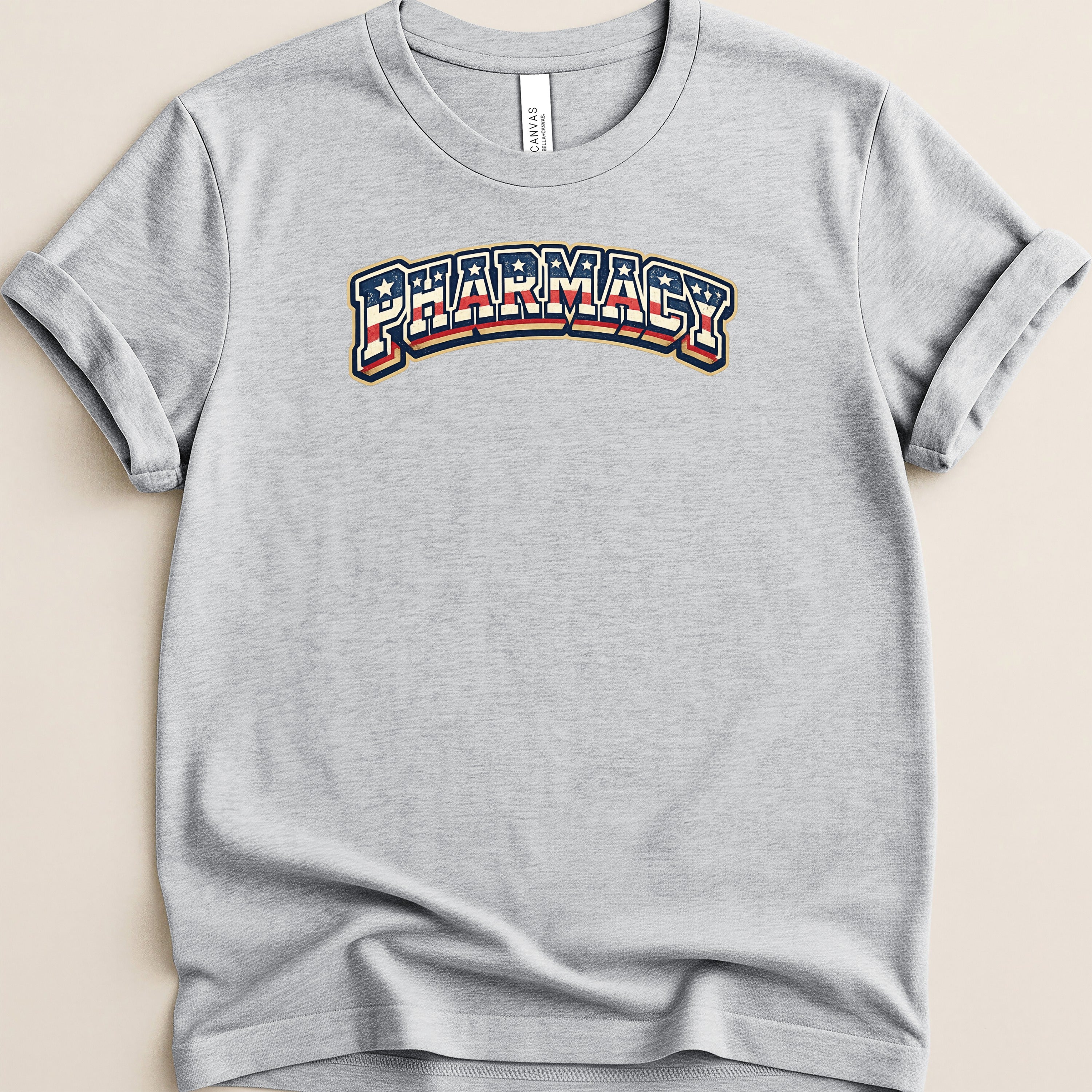 Gray t-shirt with "Pharmacy" text in distressed patriotic colors.